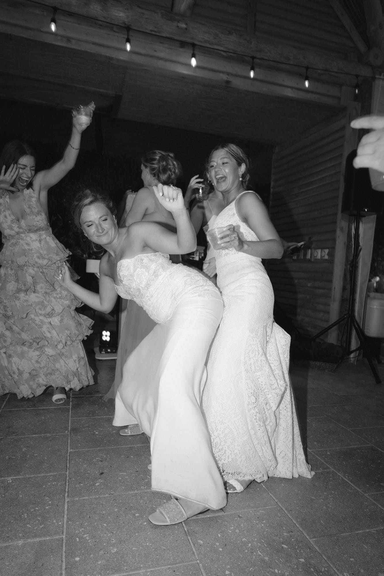 Friends dancing together in black and white