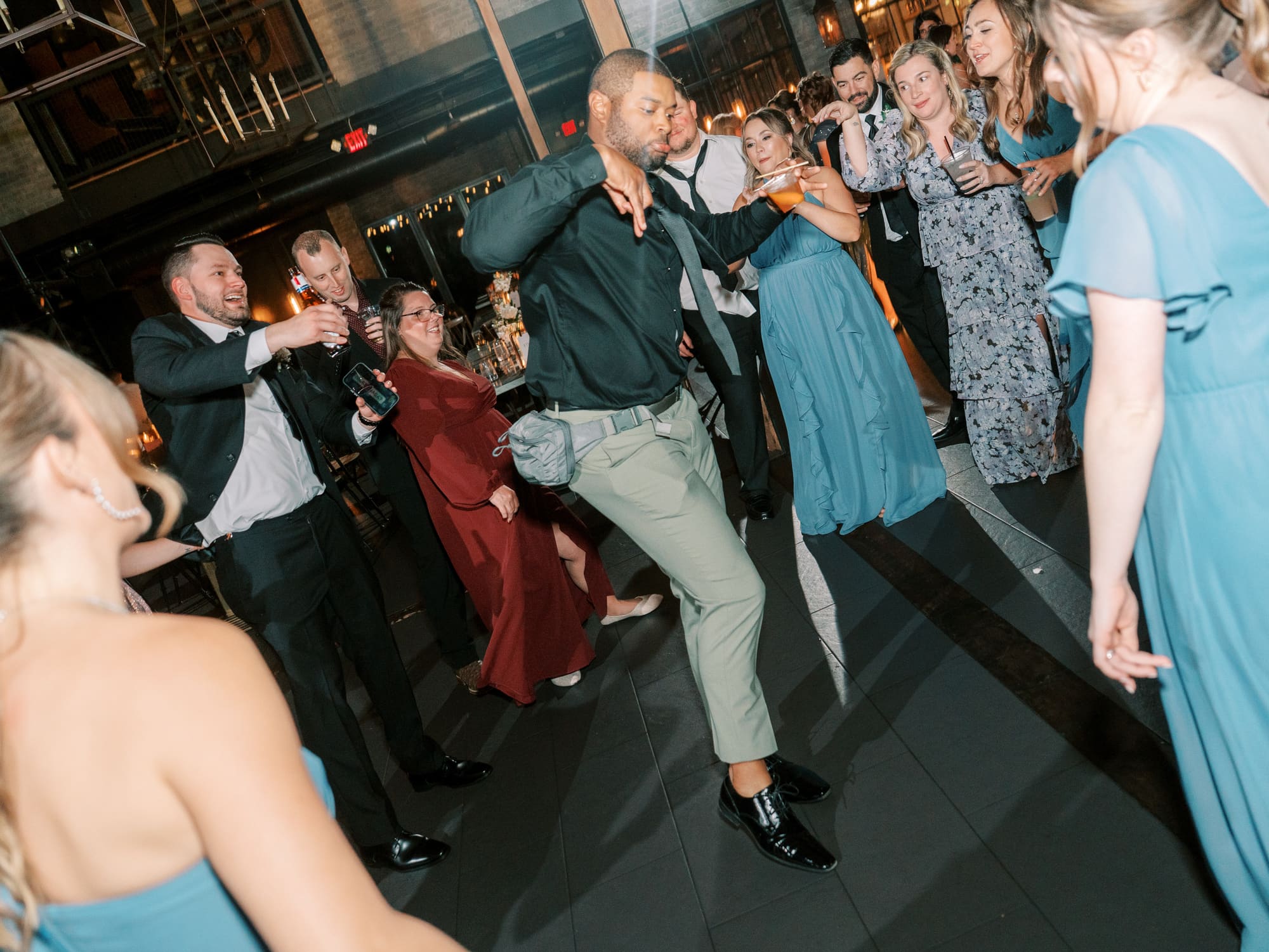 A guest dancing in the middle of the party
